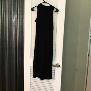 Black ribbed high neck dress.